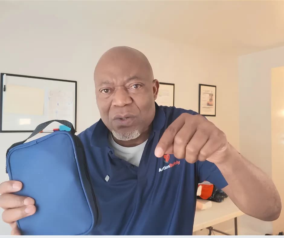 ActionBafoly instructor holding a first aid kit for contact and booking support